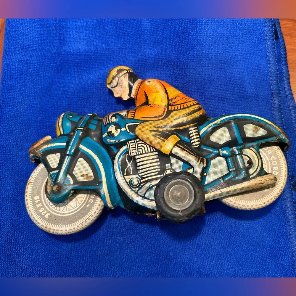 Tin Lithograph Friction Drive Ballon Cordatic toy cycle EN-12-63 Vtg 1950 Era.